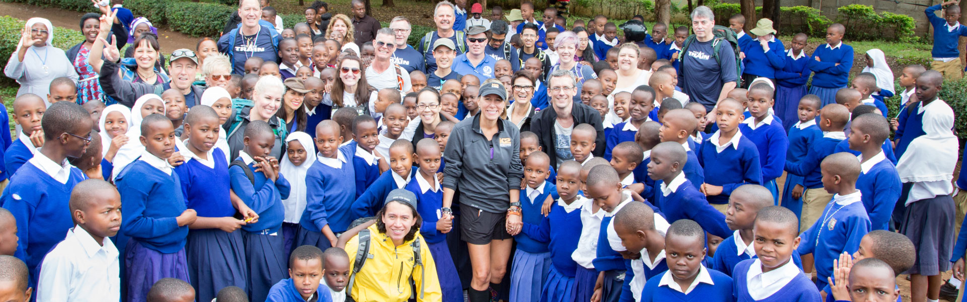 Large group of children and volunteers in Tanzania
